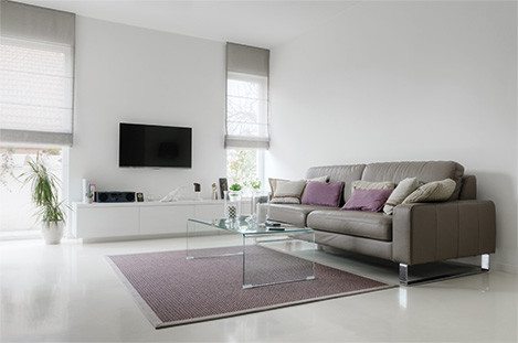 Home lounge with hidden ducted air conditioner in the ceiling