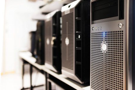 Row of black computers in a server room